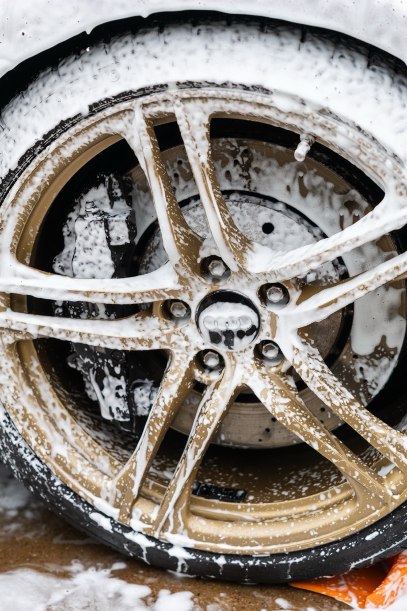 Close-up of cleaned tire and bronze wheel after detail
